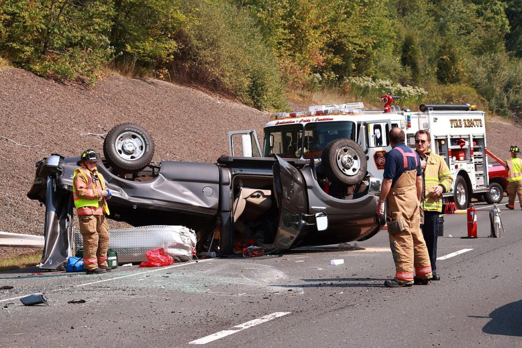 flipped car after a truck accident