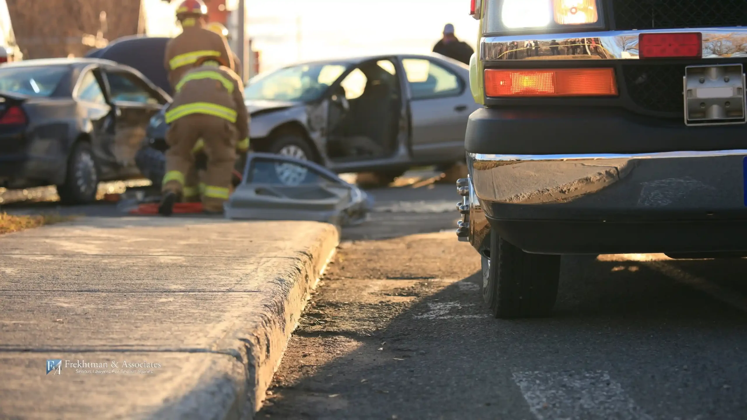 A firefighter helping car accident victims